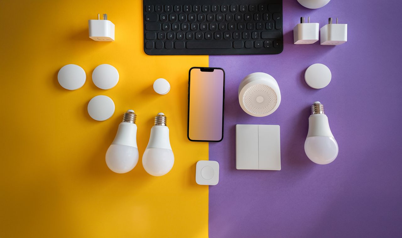 Home Flat lay of electronics, smart home gadgets on a colorful background for tech concepts.