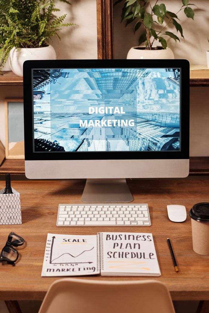 About Contemporary office setup featuring digital marketing strategy on a computer screen, ideal for business technology themes.